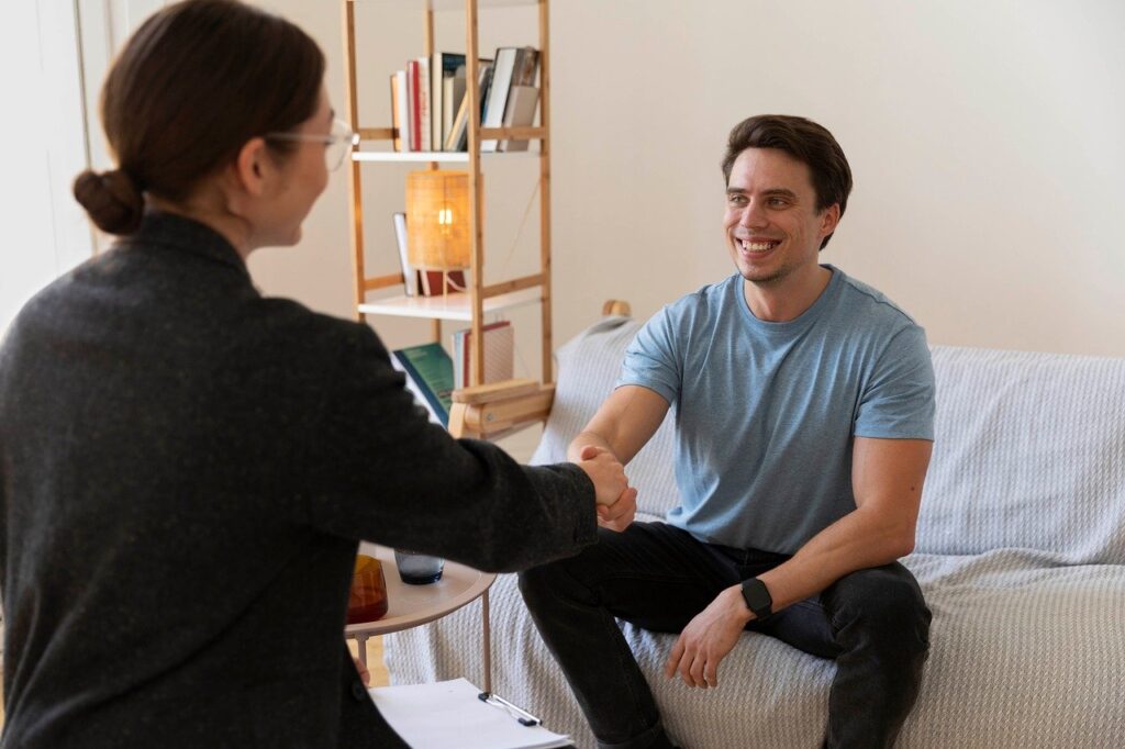 Therapist talking with client in session, best mind therapists supporting stress relief and clinical depression care."